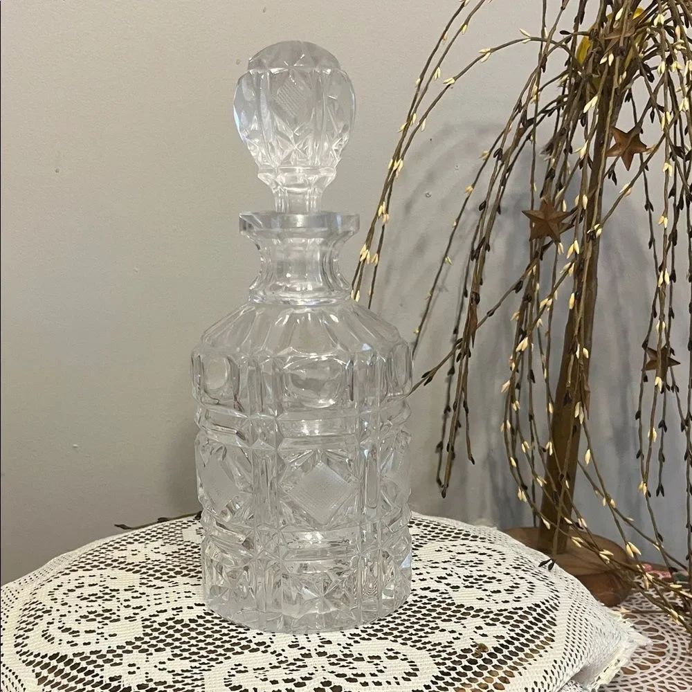 Vintage Heavy Crystal decanter with diamond cut design and matching stopper